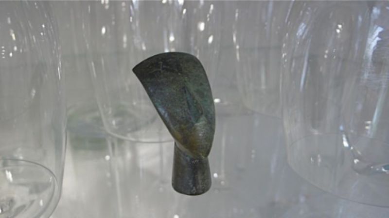 Cycladic head in glass cupboard