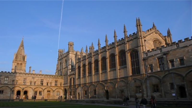 Christ Church College, with a condensation trail