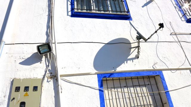 Satellite dish and shadow in the town