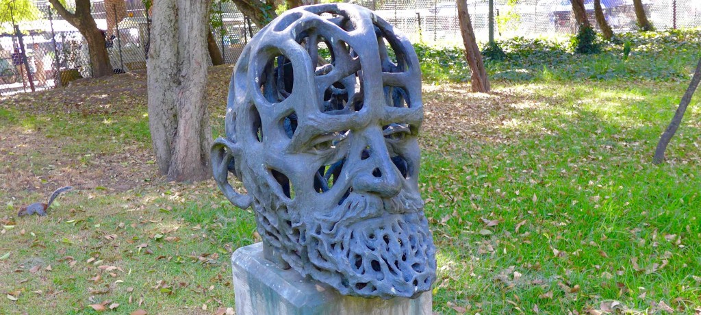 Sculpture of head - with squirrel that had been swarming through it