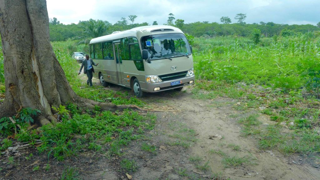 One of the two buses arrives at the cocoa plantation